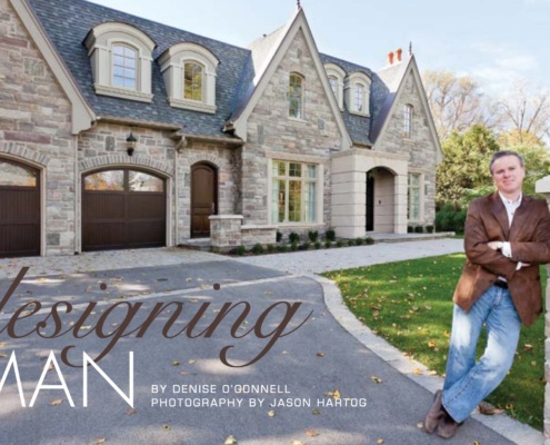 Traditional stone house with David small standing beside it.