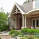 Mississauga home with natural stone, white doors and white columns.