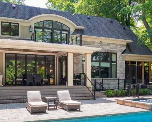 Transitional home with natural stone, wood siding and stone skirt.