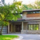 Modern renovation with steel beams, floating roof and wood trim.