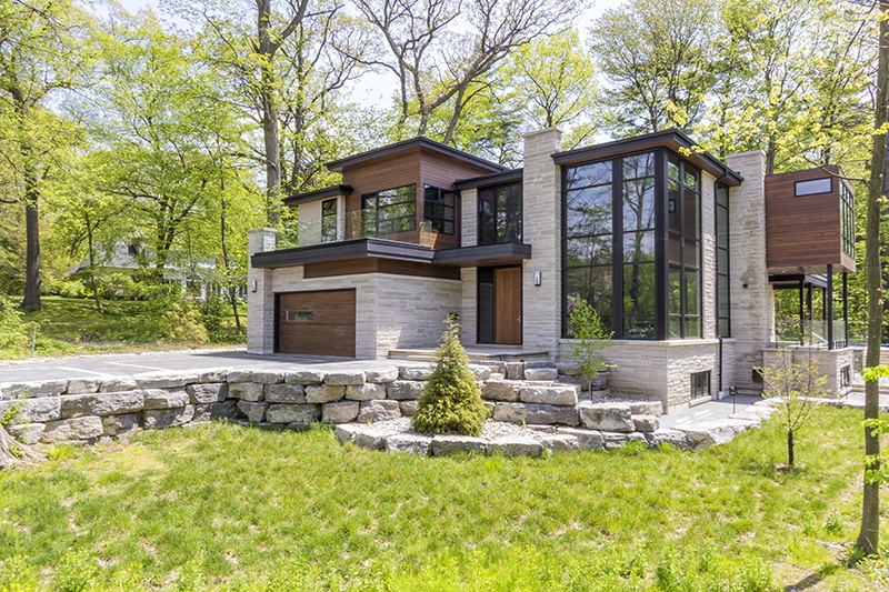 A custom home in Mississauga, designed to meet the unique setbacks of the property. By David Small Designs.
