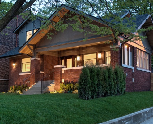 Toronto home renovation with brick, stucco siding and wood soffit.