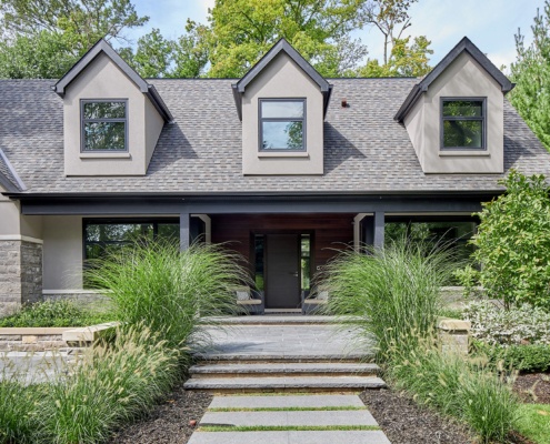Mississauga home with stone walkway, wood siding and stucco.