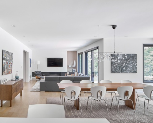 Mississauga dining room with wood table, corner window and white trim.