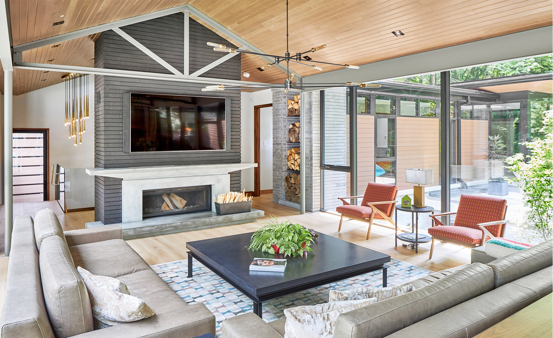 Custom home with steel beam, stone wall and concrete mantel.