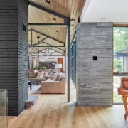 Modern home with concrete wall, hardwood floor and steel column.