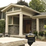 Mississauga renovation with shingled windows, green shutters and white trim.