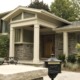 Mississauga renovation with shingled windows, green shutters and white trim.