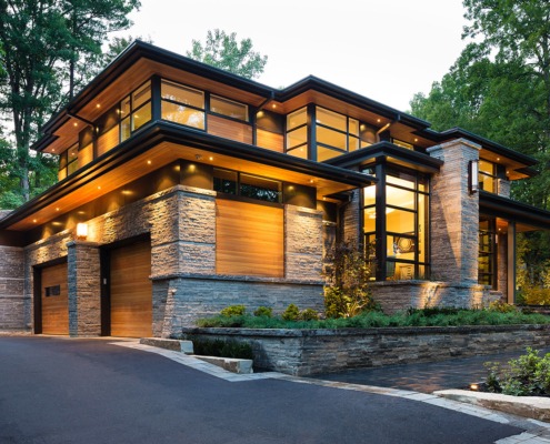 Mississauga modern home with natural stone, metal cladding and flagstone walkway.