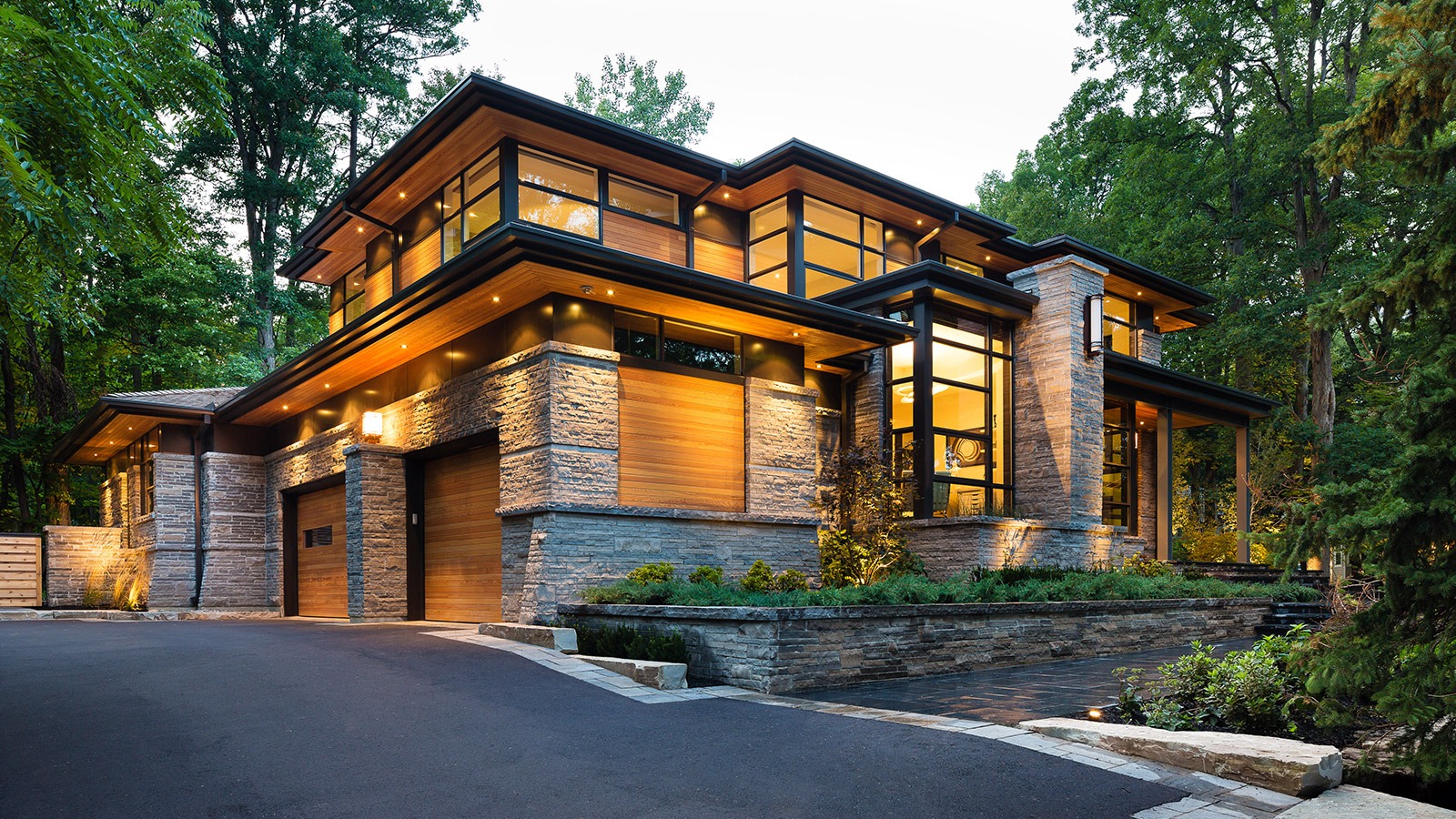 Mississauga modern home with natural stone, metal cladding and flagstone walkway.