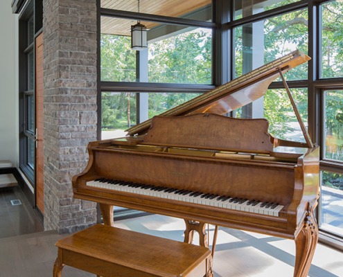 Contemporary house with corner windows, natural stone and wood floor.