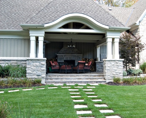 Back deck with stucco column, natural stone and eyebrow.