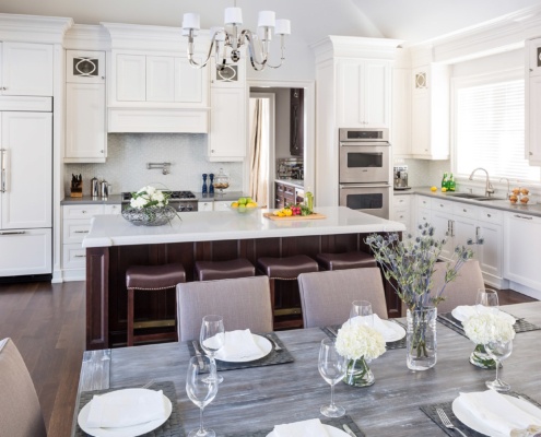 Dining room with wood dining table, gray chairs and hardwood floor,