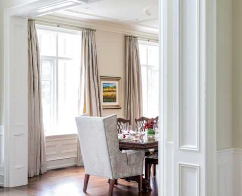 Oakville dining room with tile floor and wall detailing.