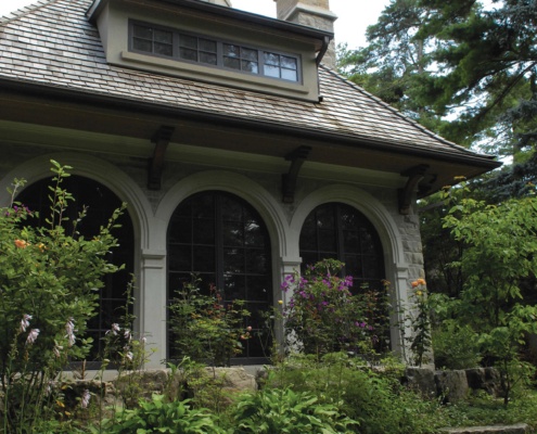 Mississauga home with brick chimney, wood shingles and cupola.