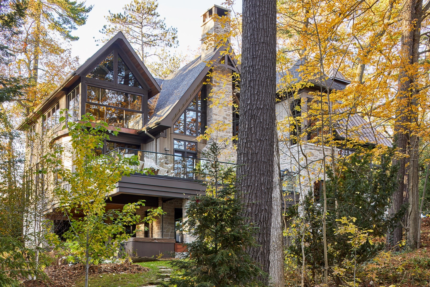 Mississauga with wood soffit, black frame windows and wood siding.