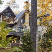 Mississauga with wood soffit, black frame windows and wood siding.