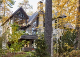 Mississauga with wood soffit, black frame windows and wood siding.