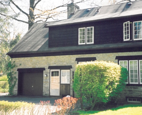 Stone and wood house before renovation.