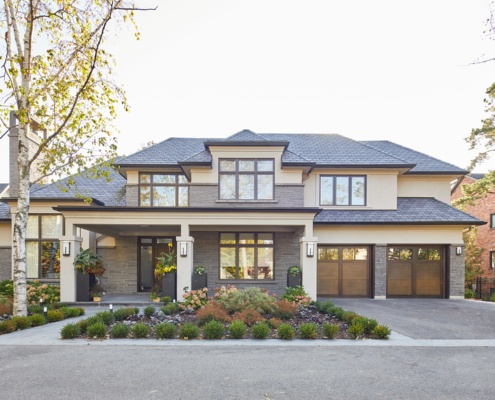 Traditional house with stucco siding, large overhangs and clean lines.