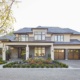 Traditional house with stucco siding, large overhangs and clean lines.