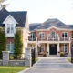 Home renovation with red brick, white trim and covered porch.