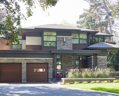 Toronto custom home with wood siding, floor to ceiling windows and floating roof.