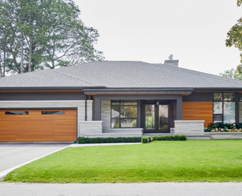 Contemporary house with natural stone, wood siding and steel beam.