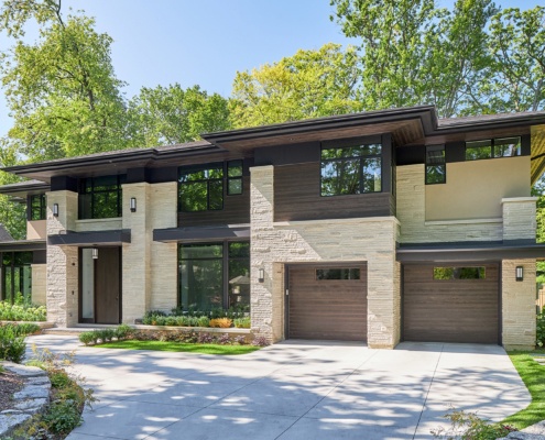 Modern house in Mississauga with wood garage door, stucco siding and floating roof.