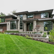 Contemporary house with black frame window, steel column and landscape wall.