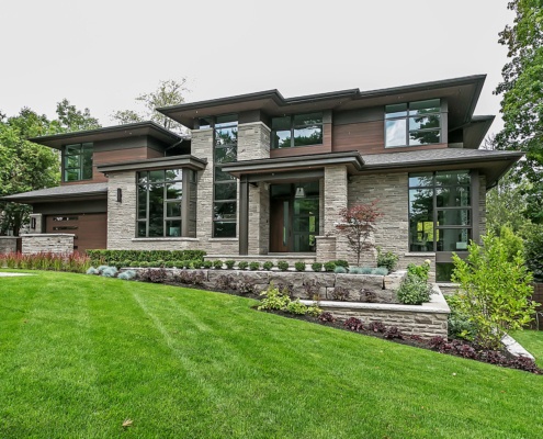 Contemporary house with black frame window, steel column and landscape wall.