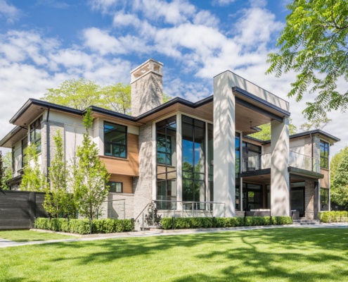 Mississauga house with wood siding, stone chimney and stucco columns,