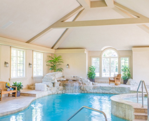 Home with indoor pool and tile floor.