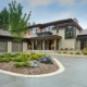 Modern Edmonton home wtih stone siding, metal cladding and 3 car garage.