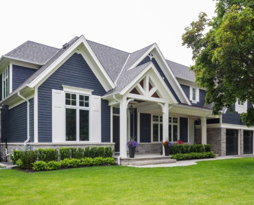 Traditional home with wood siding, natural stone and covered entry.