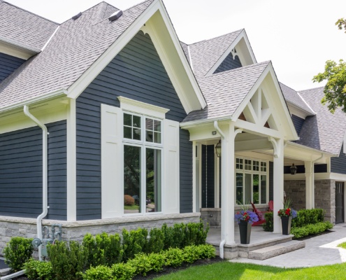 Mississauga house with white frame windows, white trim and stone skirt.