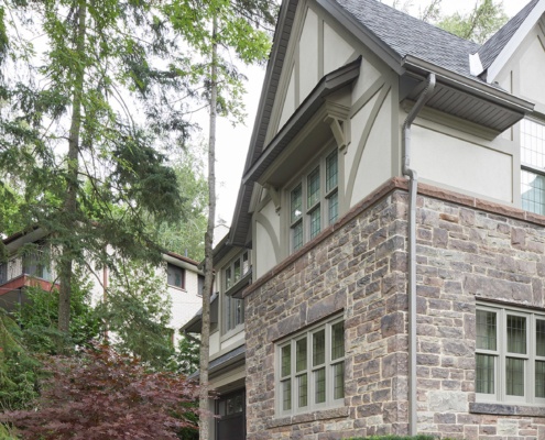 Toronto home with stone siding, stucco and beige trim.