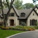 Mississauga home with stucco siding, wood front door and brick.