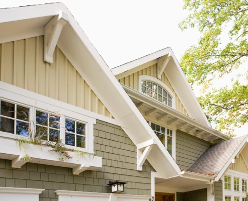 Mississauga house with board and batten siding and white trim.