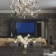 Dining room with square dining table, brown chairs and metal chandelier.