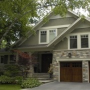 Mineola home with stucco siding, white frame windows and