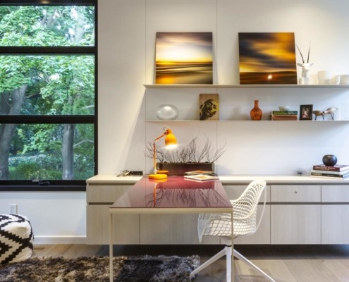 Contemporary office iwth corner window, hardwood floor and white wall.