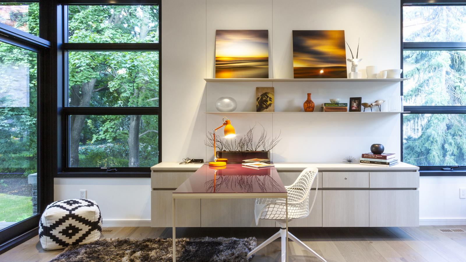 Contemporary office iwth corner window, hardwood floor and white wall.