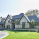 Toronto home with scones, stone planters and circular driveway.