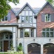 Toronto house with red brick, gray trim and white stucco.