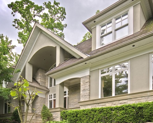 Mississauga house with gabled roof, stucco siding and natural stone.
