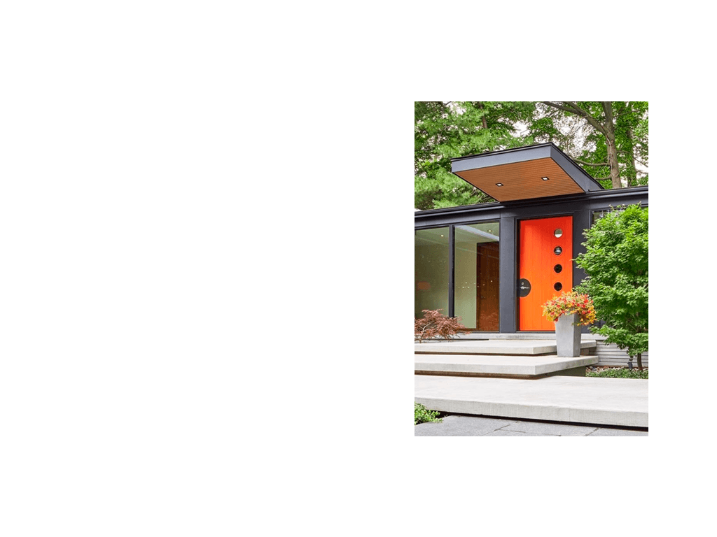Contemporary front entry with concrete steps, wood soffit and orange door.
