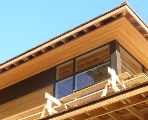 Construction of wood siding and wood soffit for contemporary home.