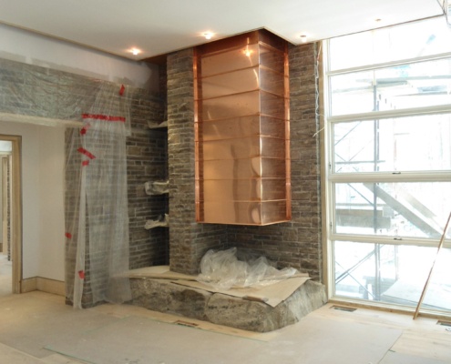 Mississauga family room with copper fireplace, floor to ceiling window and hardwood floor.