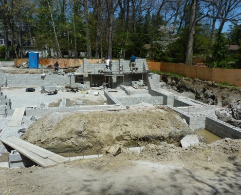 Workers building concrete for Mississauga house.